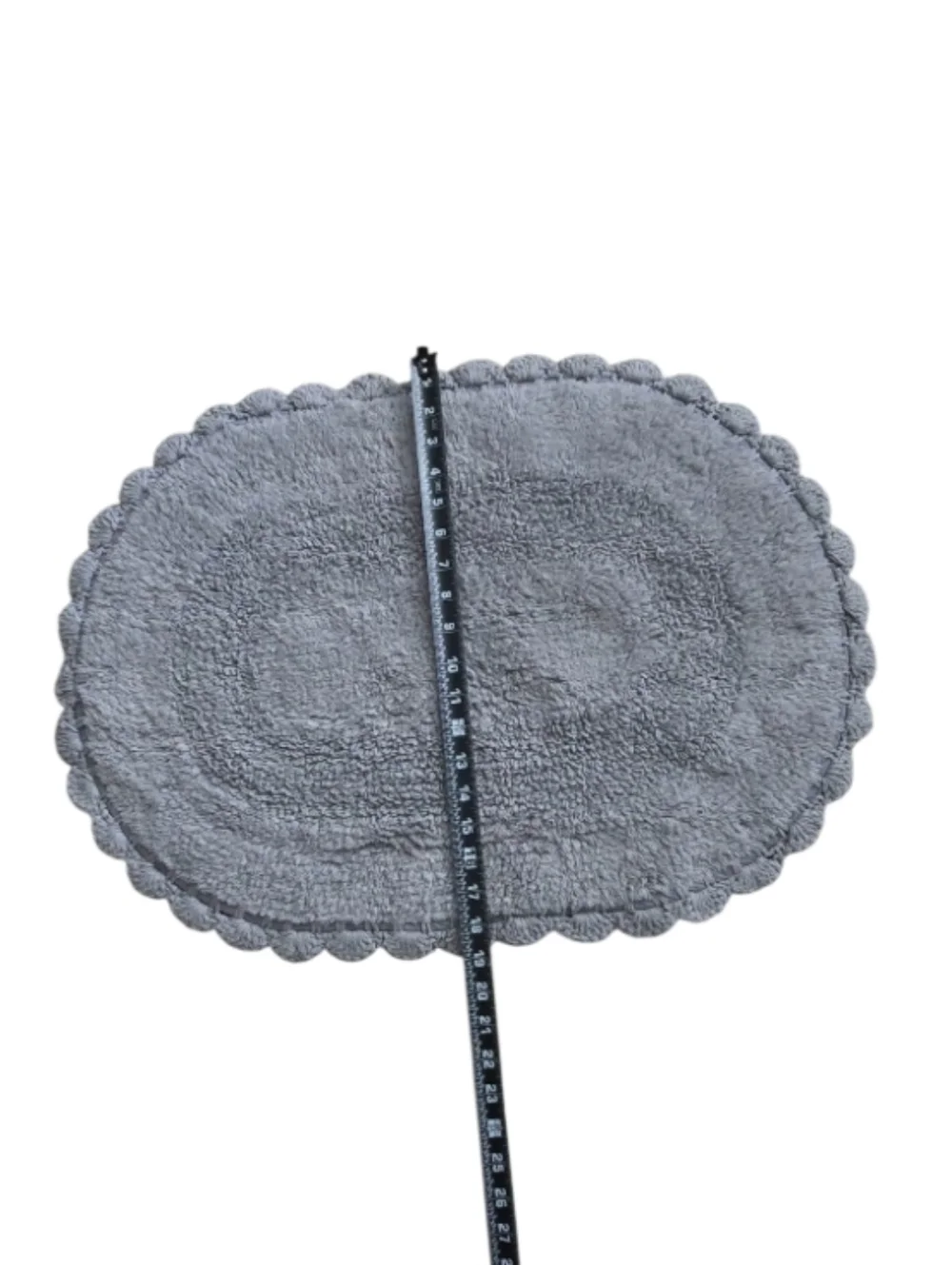 2-piece set of oval cotton bath rugs featuring a crochet border